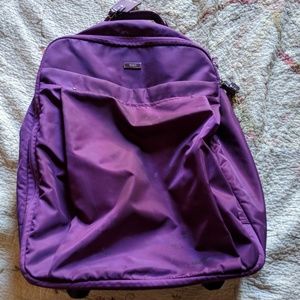 Tumi rolling carry on and bag